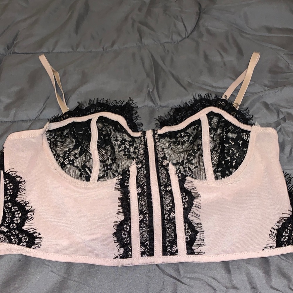 Tan and black crop tank with lace design and side zipper